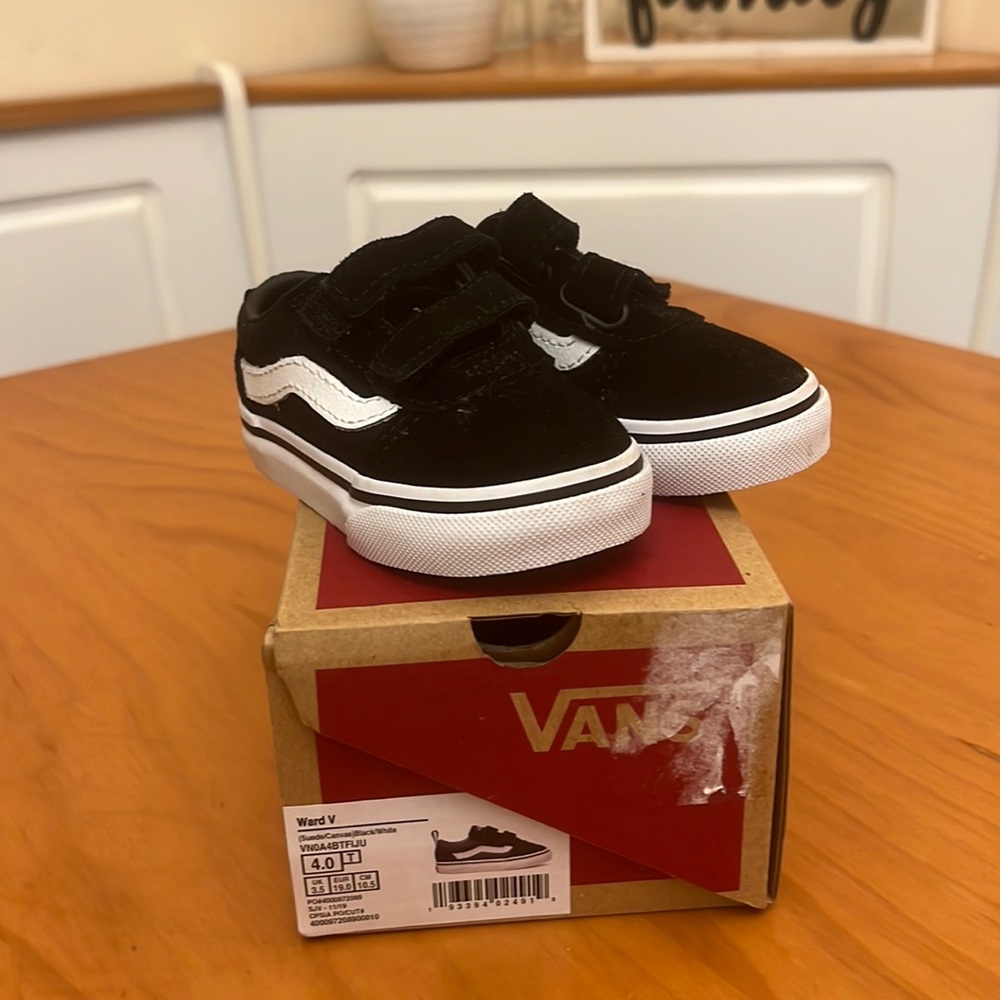 Size 4. T black and white suede/canvas vans .  Never worn